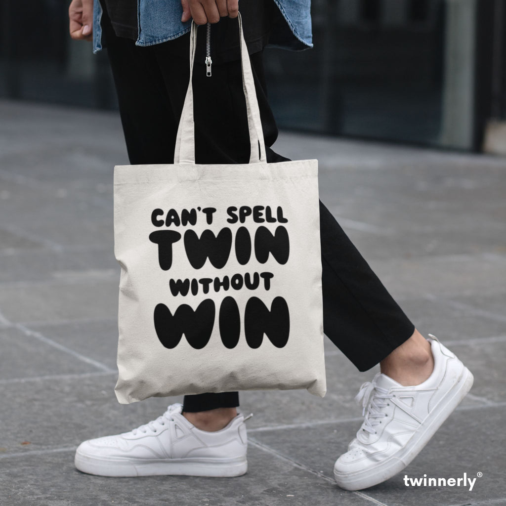 person wearing white shoes carrying tote bag